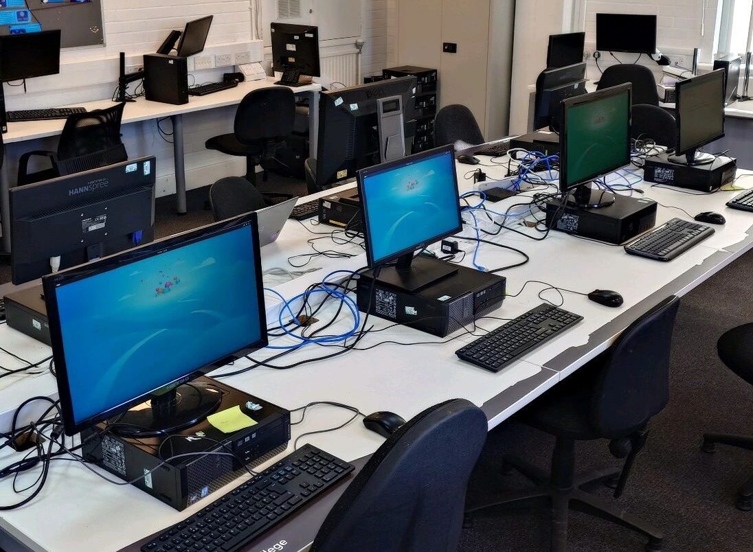 Multiple computers in a classroom.